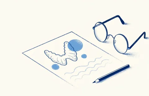 Thyroid ultrasound report on a desk, with a drawing of the gland, a pair of glasses and a pencil.